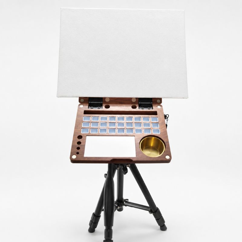 Walnut painting kit on a tripod and blank watercolor paper clipped